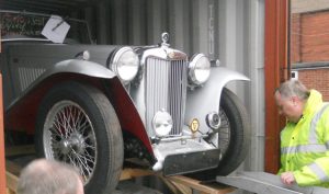 Load Silver Antique Roadster for Shiment to the UK