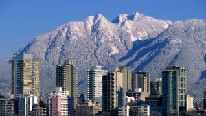 Dense and complex downtown apartment living versus countryside living in Deep Cove are different moving realities